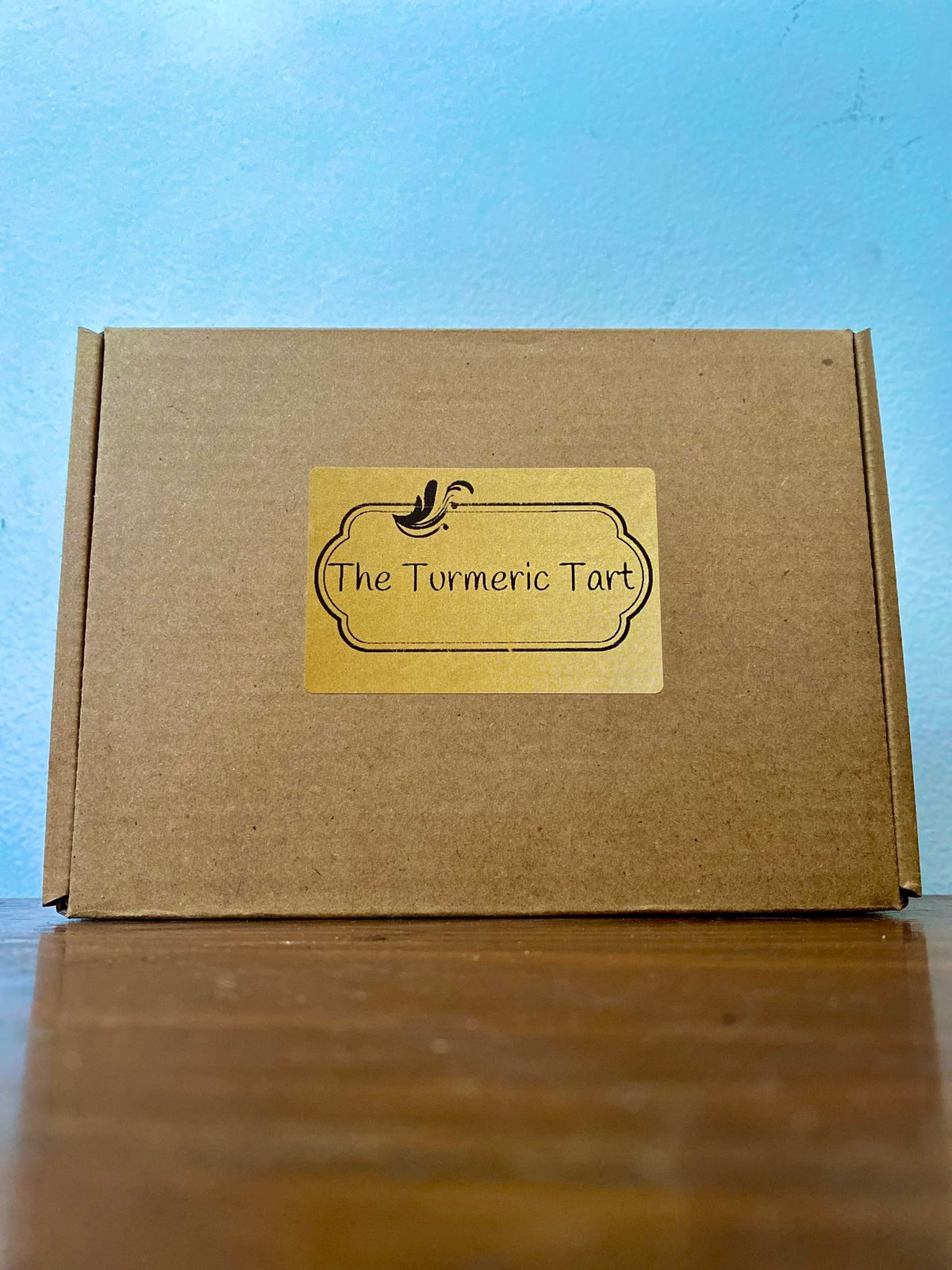 Closed kraft Greenhorn Starter Set gift box with The Turmeric Tart label