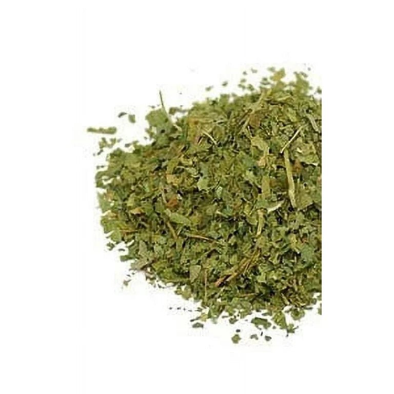 Pile of organic dried passionflower herb, cut and sifted, on a white background