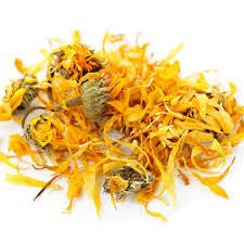 Organic dried calendula flowers with orange and yellow petals on a white background
