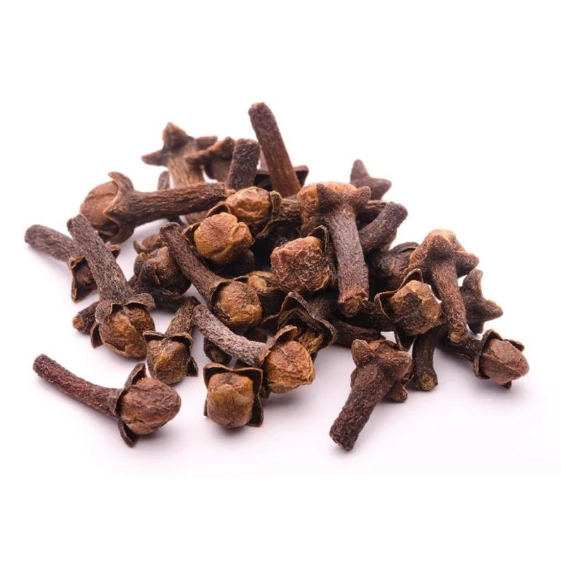 Pile of organic whole cloves on a white background