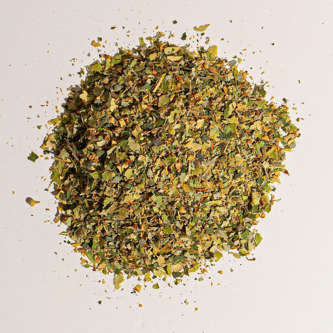 Pile of organic dried linden flowers and leaves, cut and sifted