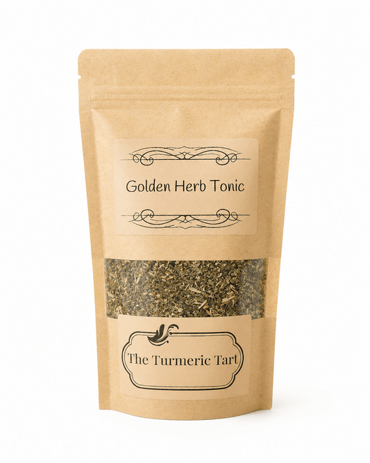 Golden Herb Tonic loose leaf herbal tea in a kraft pouch with a window, by The Turmeric Tart