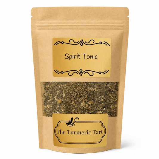 Spirit Tonic loose leaf herbal tea in a kraft pouch with a window, by The Turmeric Tart