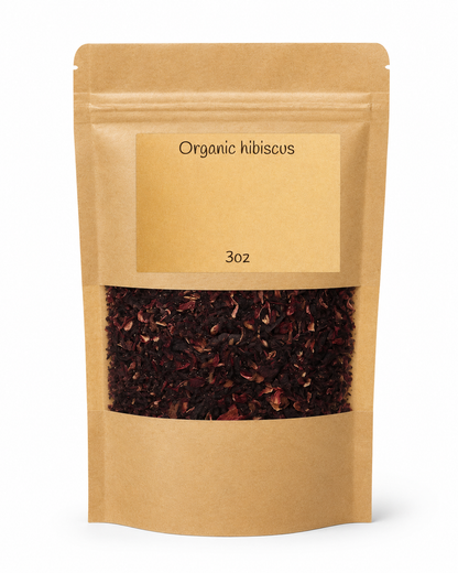 Kraft paper packaging of organic hibiscus with visible contents on a white background